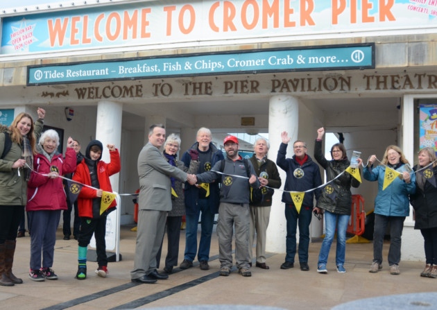 Kieran Sandwell with Cromer deputy mayor John Frosdick and members of the Walkers are Welcome group. Picture: DAVE ROBERTS